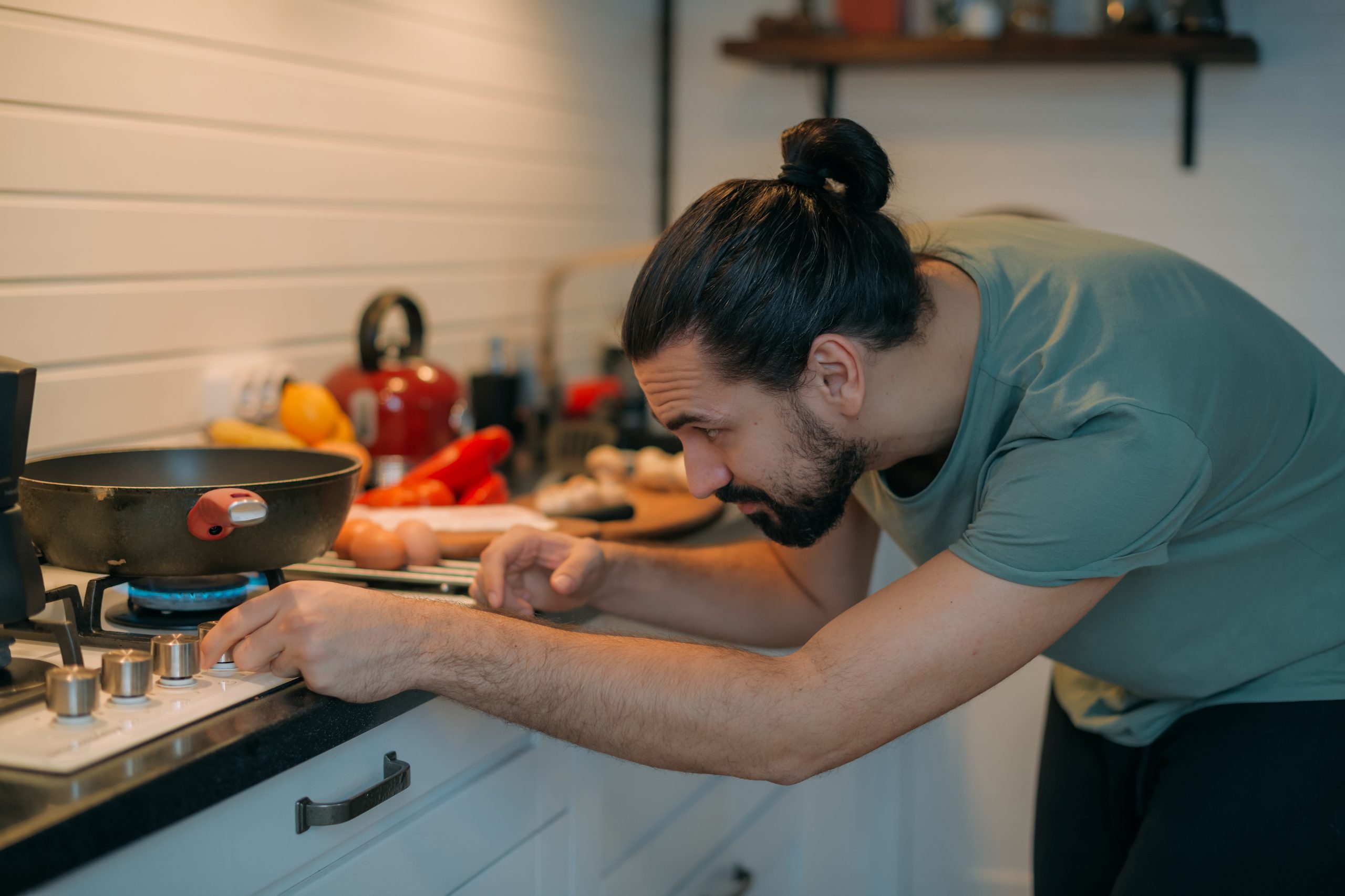 A,Man,Prepares,Breakfast,In,The,Kitchen.,Young,Handsome,Caucasian